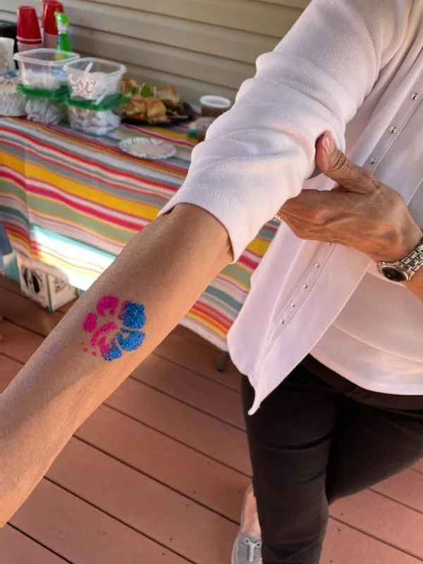 A rainbow temporary tattoo on an arm